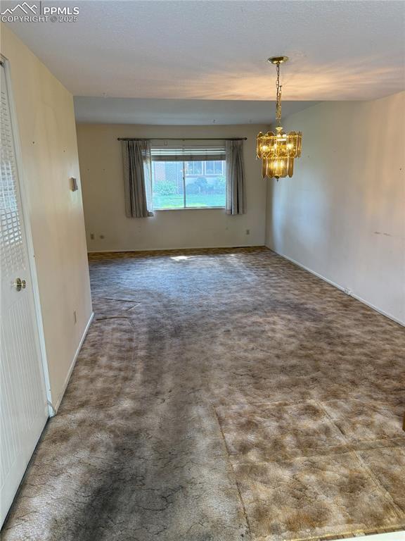 Image 7 of 33: View of dining room from kitchen