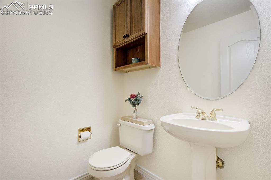 Image 19 of 50: Bathroom with toilet and baseboards