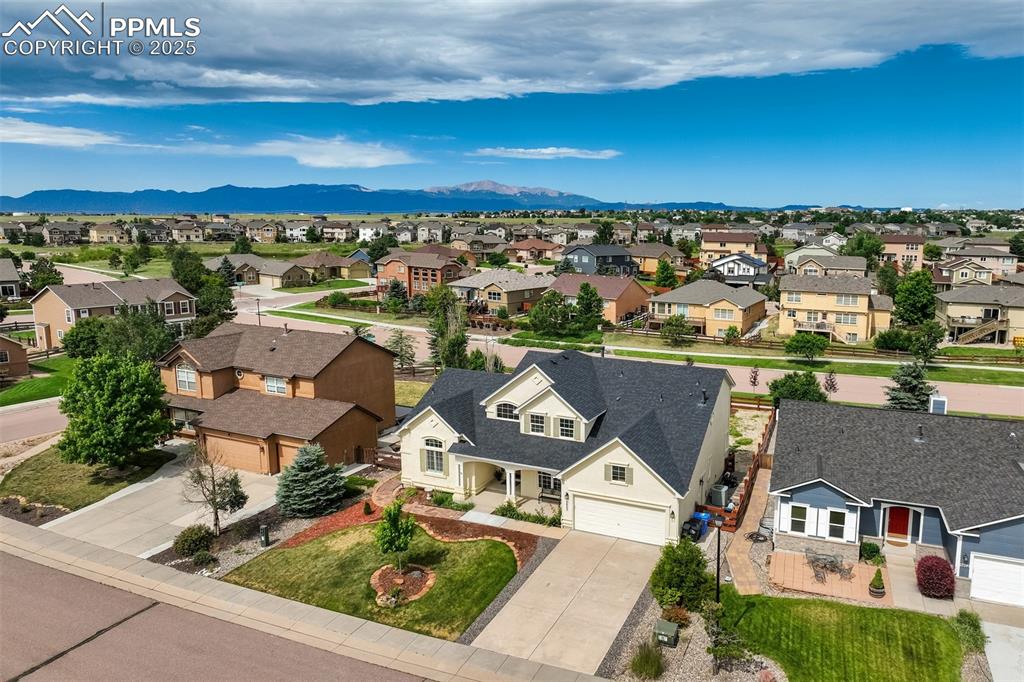 Image 3 of 50: Aerial view of residential area with mountains