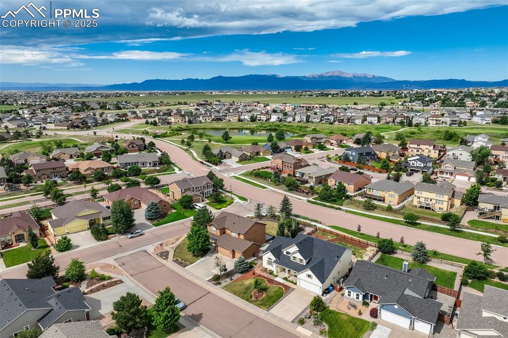 Image 4 of 50: Aerial perspective of suburban area with a water and mountain view