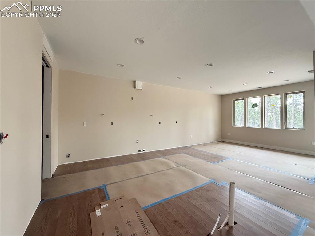 Image 11 of 18: Quartz Counters, Wood Flooring, Stainless Steel Appliances, Fridge included