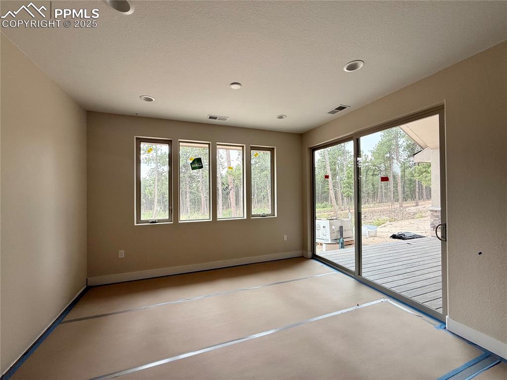 Image 13 of 18: Dining Area Walks Out to Covered Deck.