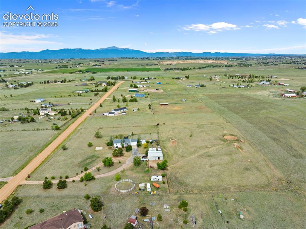 Image 50 of 50: Expansive rural property featuring a large primary residence, multiple outb