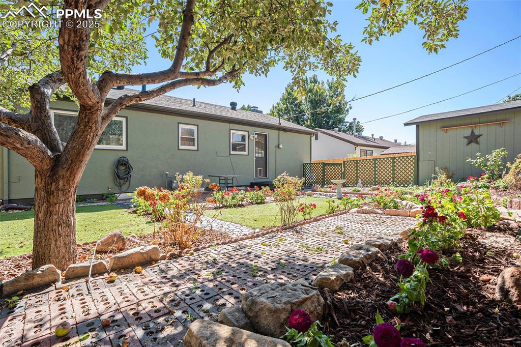 Image 22 of 24: Back of house featuring stucco siding