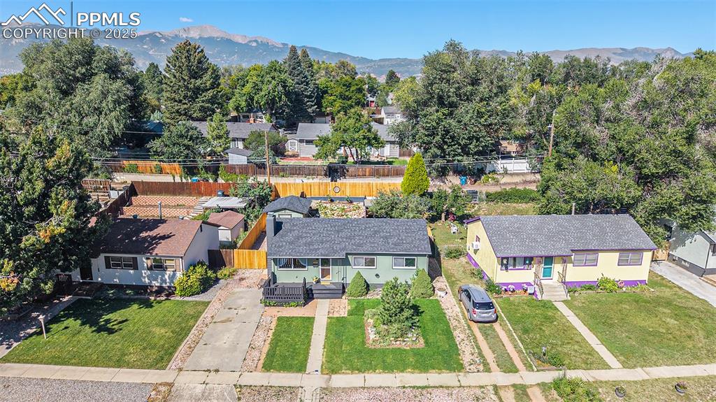 Image 23 of 24: Aerial perspective of suburban area featuring mountains