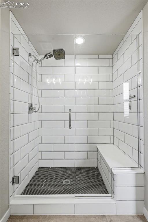 Image 25 of 45: bench in primary shower