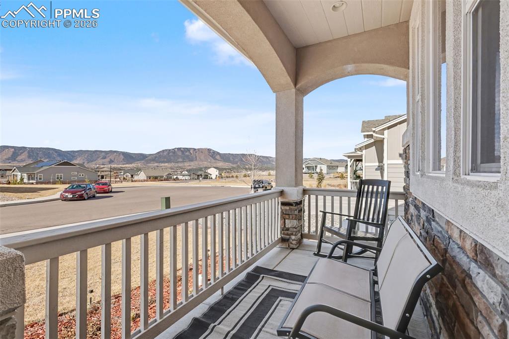 Image 4 of 45: covered front porch with mountain view