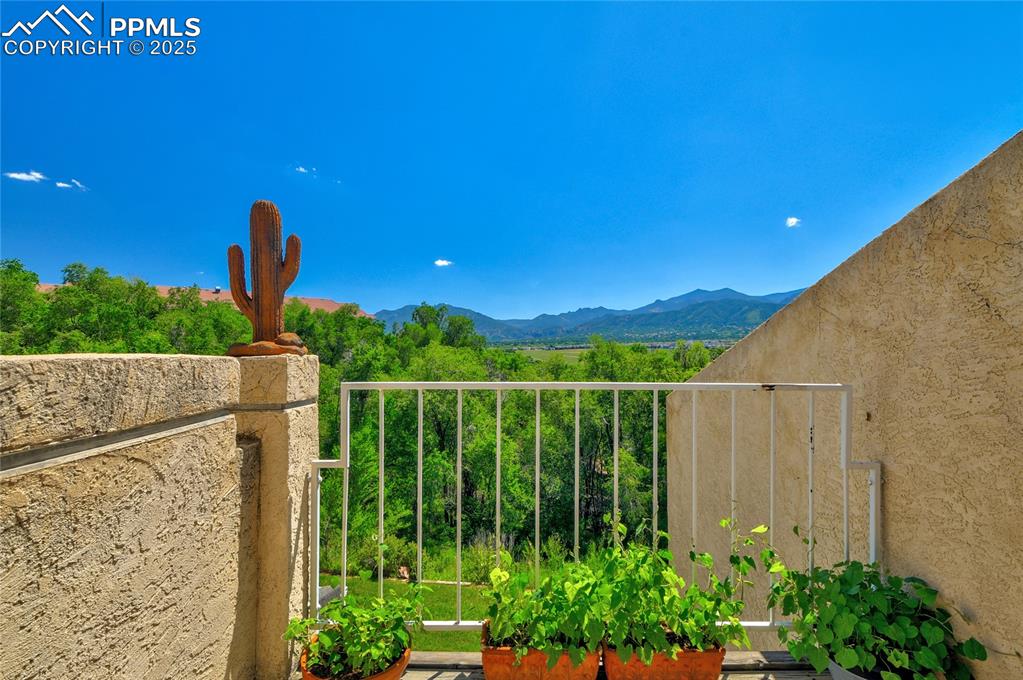 Image 20 of 22: View of mountain background outside main level balcony