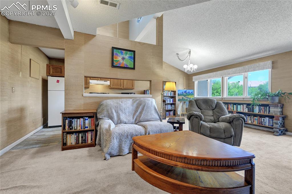 Image 6 of 22: Living area with open floor plan