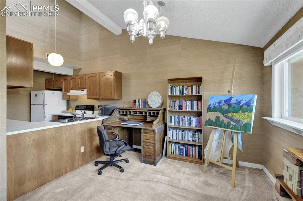 Image 9 of 22: Office area with vaulted ceiling, could also be used as a dinning area