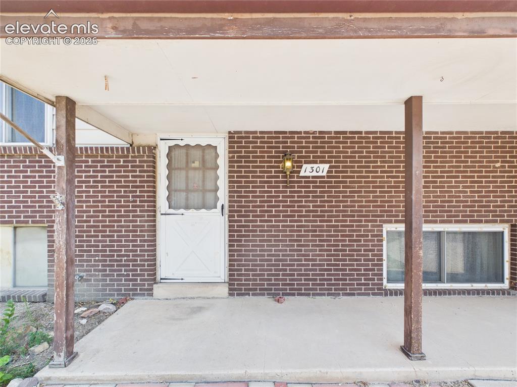 Image 3 of 50: Covered Front Porch – Welcoming covered front porch provides a sheltered en