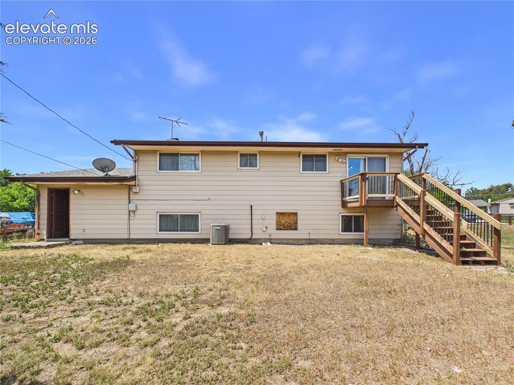 Image 36 of 50: Rear Exterior – Full rear elevation highlights the home