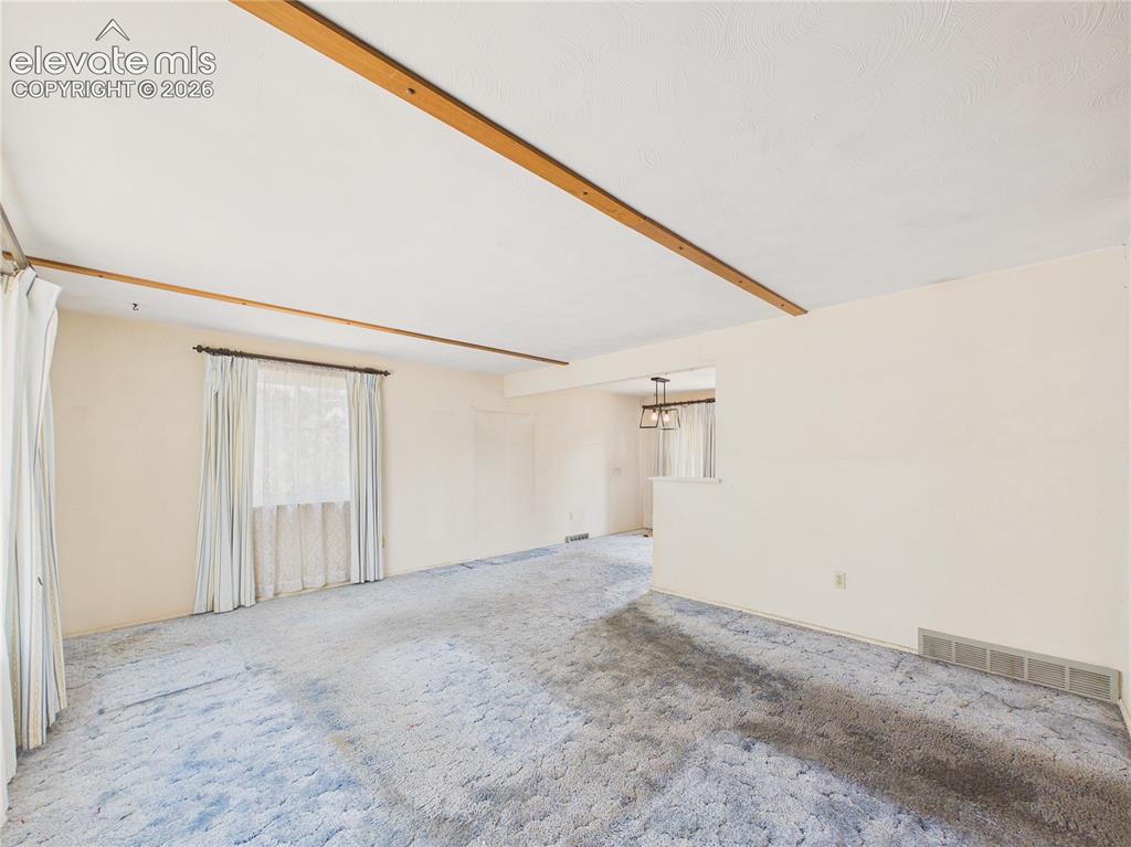 Image 6 of 50: Bright and inviting main living area connects seamlessly to the kitchen and