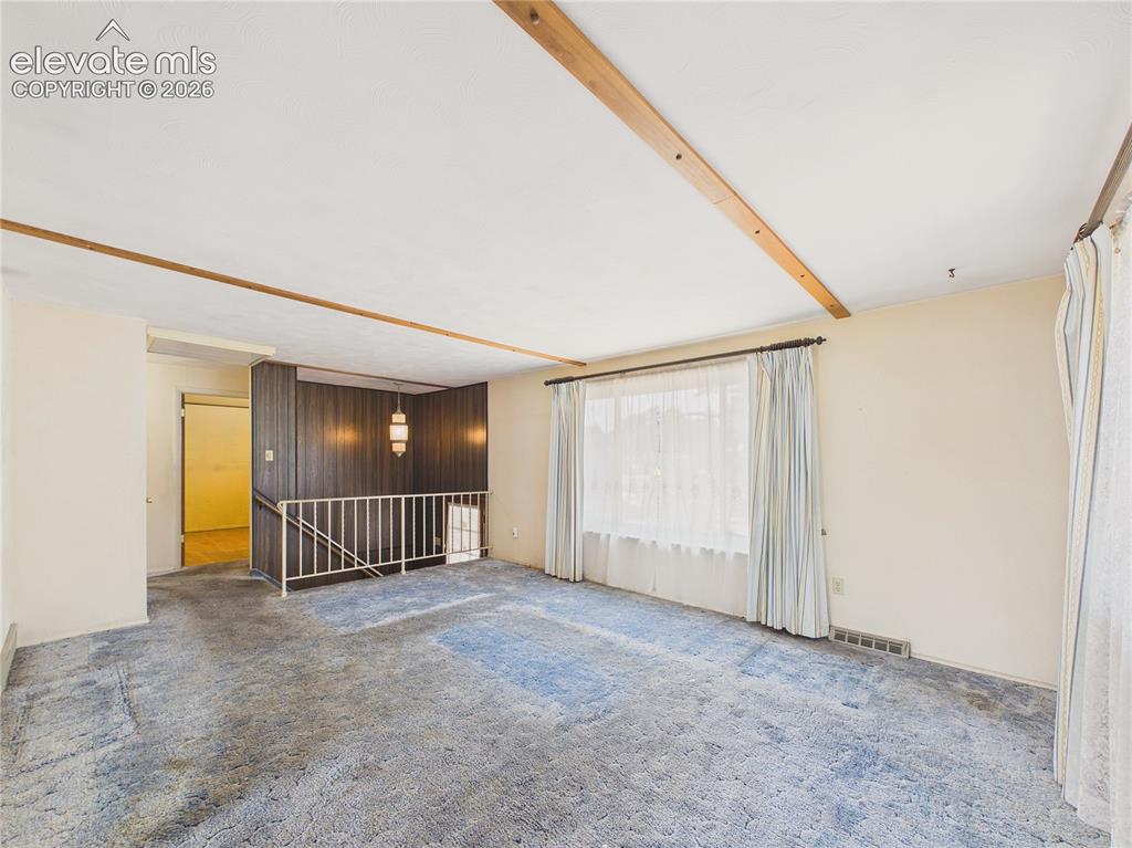 Image 7 of 50: Bright and inviting main living area connects seamlessly to the kitchen and