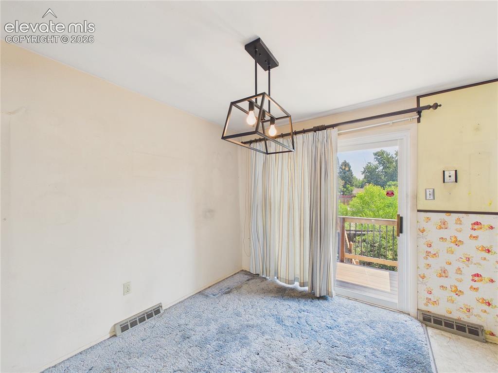 Image 8 of 50: Dining space is conveniently located beside the kitchen and opens directly 