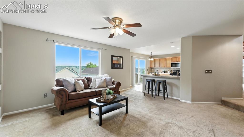 Image 16 of 50: The Family Room has a counter bar overlooking the Kitchen for casual conver