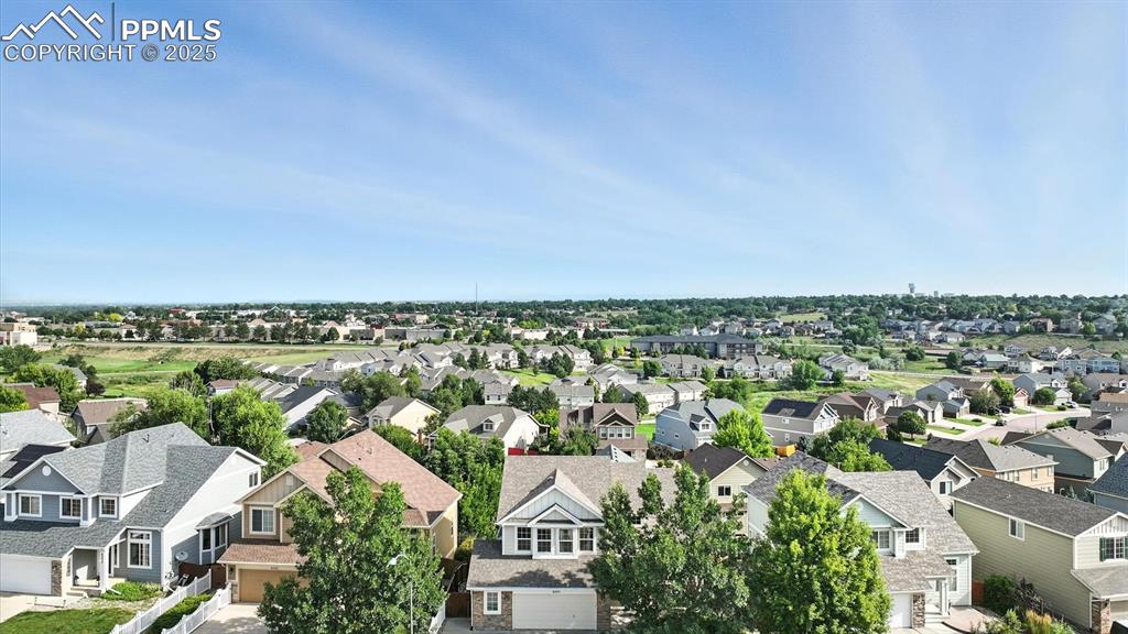 Image 2 of 50: Aerial front view of home and neighborhood.