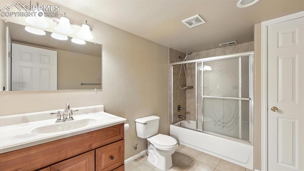 Image 37 of 50: Full Bathroom with vanity, mirror, and tub/shower in the Finished Basement.