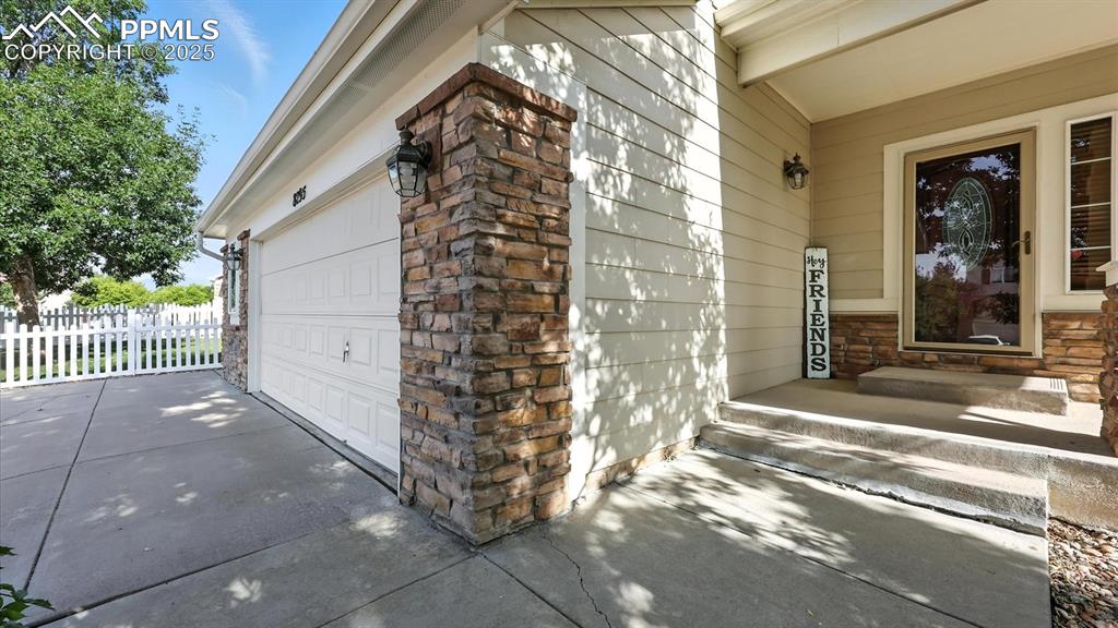 Image 4 of 50: A covered front porch & storm door entry welcome you inside.