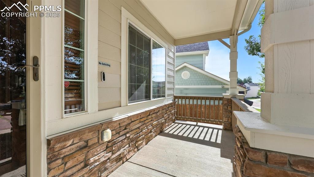 Image 5 of 50: Covered front porch to enjoy your morning coffee and the Colorado sunshine.