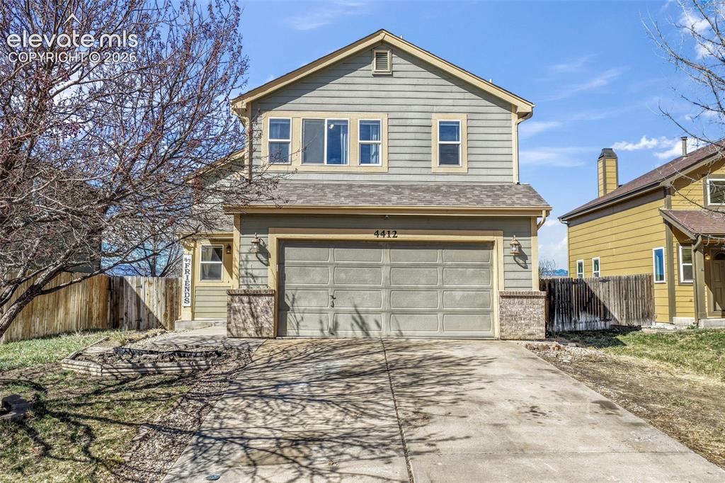 Image 1 of 50: Two-story residence featuring horizontal siding, a two-car garage, and ston