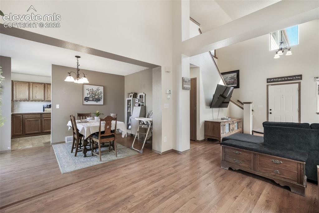Image 10 of 50: Vaulted ceilings with architectural beams highlight the living space