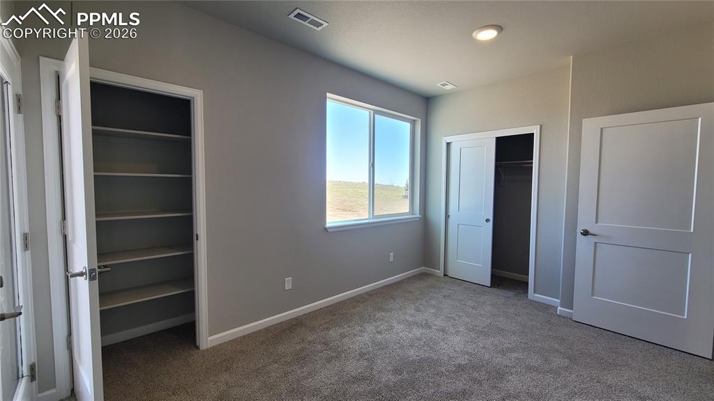 Image 6 of 39: Junior Suite on the Entry Level with a 3/4 bathroom, linen closet, and walk